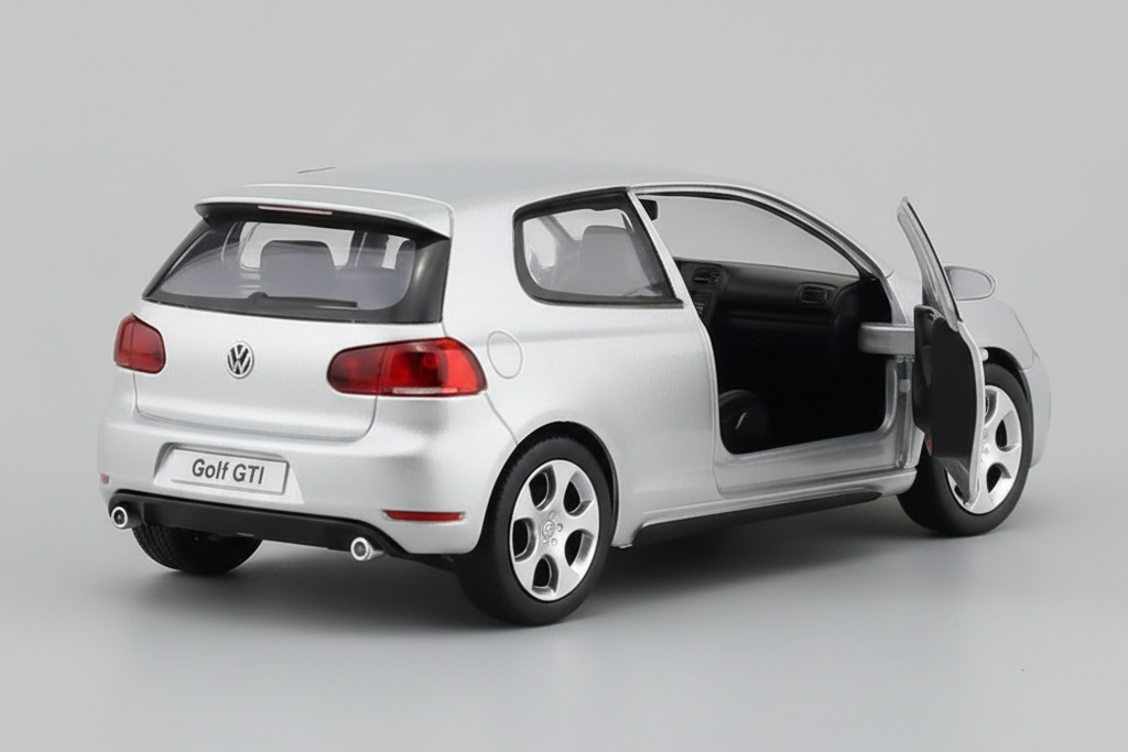 Model car of a silver Volkswagen Golf GTI on a white background