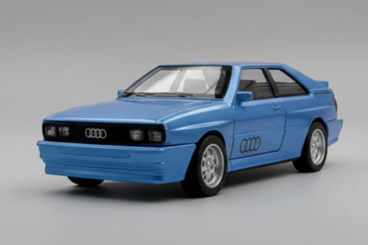 Blue Audi car model on a reflective surface with a black and yellow striped background