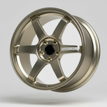 Gold rays te37 wheel rim on a stand with a gray background