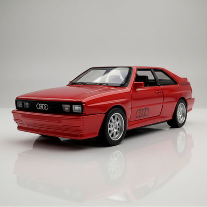 Blue Audi car model on a reflective surface with a black and yellow striped background