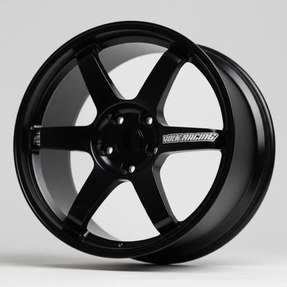 Black rays te37 wheel rim on a stand with a light gray background