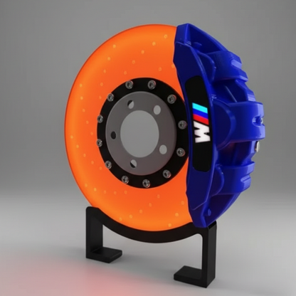 Brake disc and caliper with BMW logo on a stand against a dark background