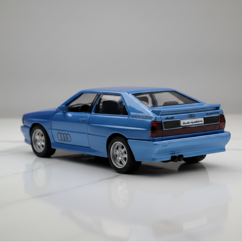 Blue model car with Audi logo on a reflective surface