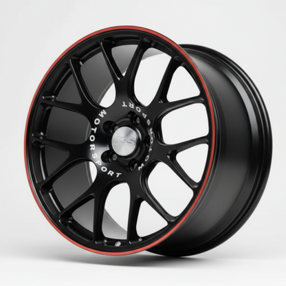 Black alloy wheel with red accents on a white background facing left