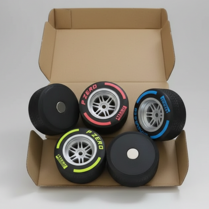 Five toy car wheels with 'P Zero' branding on a cardboard surface.